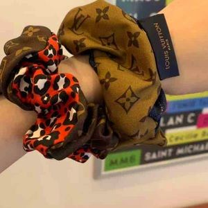 2 Set/Pair LOUIS VUITTON
Silk Monogram Scrunchies